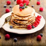 Pancakes on wooden table